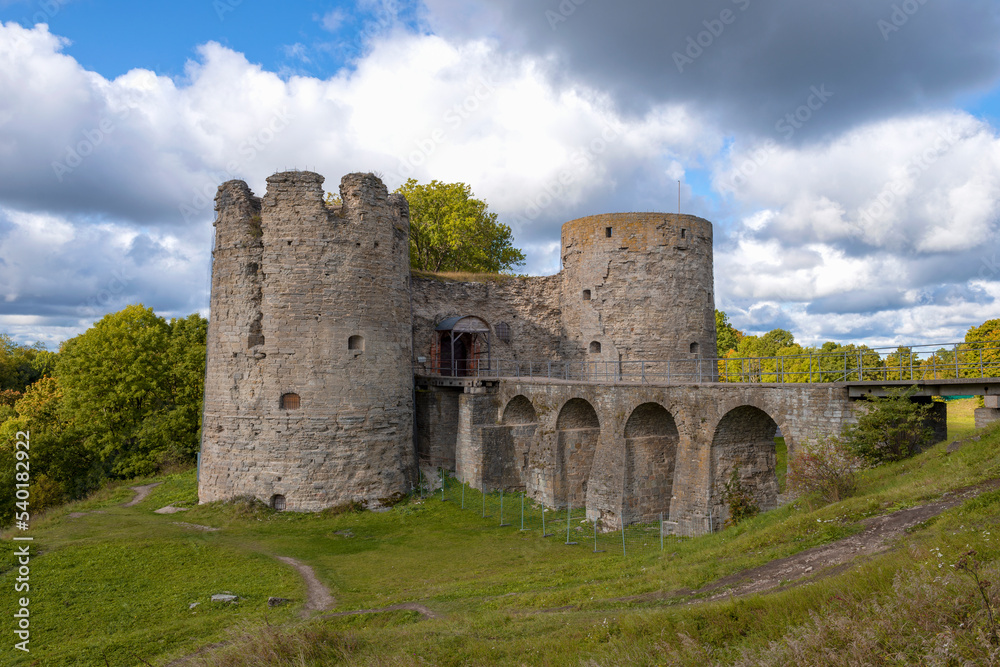 Ancient Koporye fortress under a cloudy sky on a September day. Leningrad region, Russia