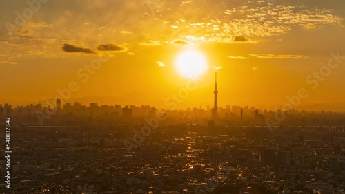 Time lapse video of Tokyo cityscape with Tokyo Skytree and Mt. Fuji silhouette from dusk to night.