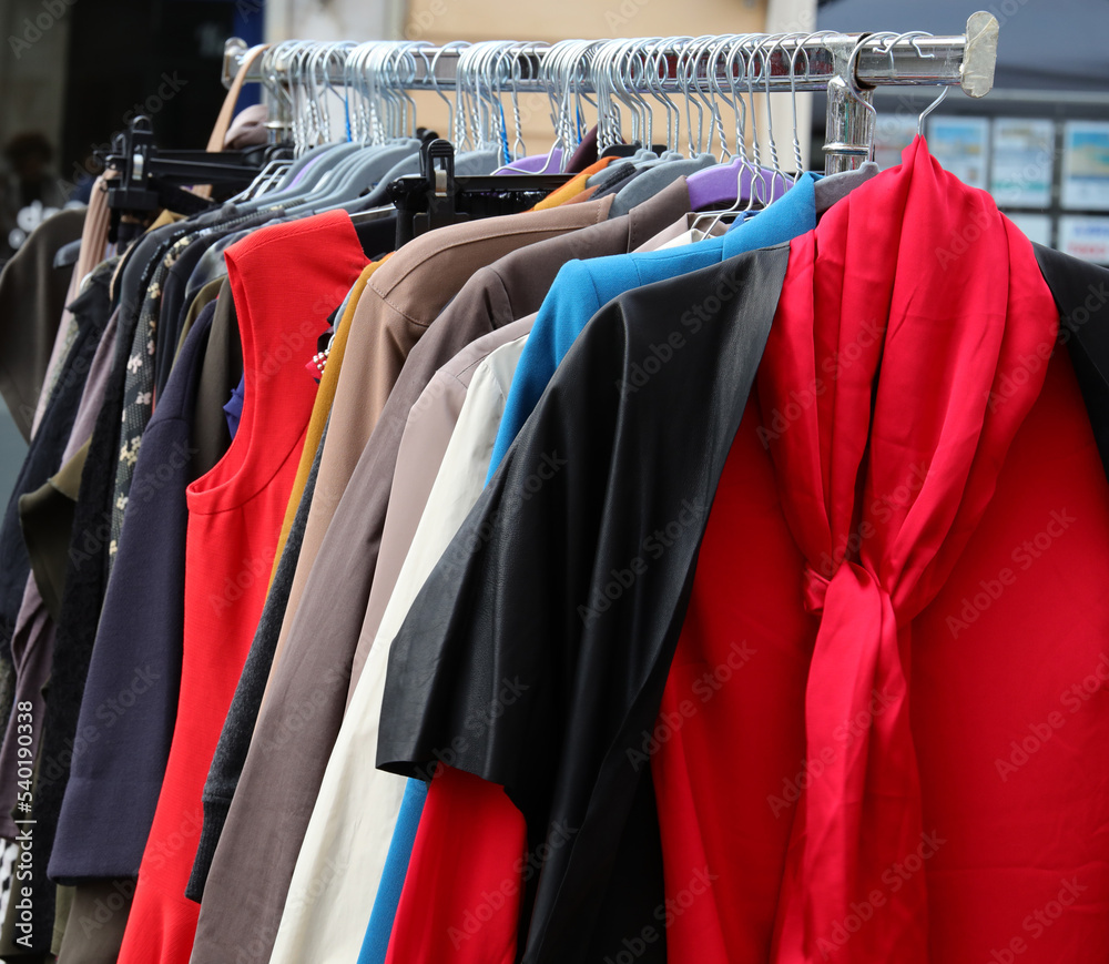 red shirt with scarf and other clothes for sale in used and new clothes stall