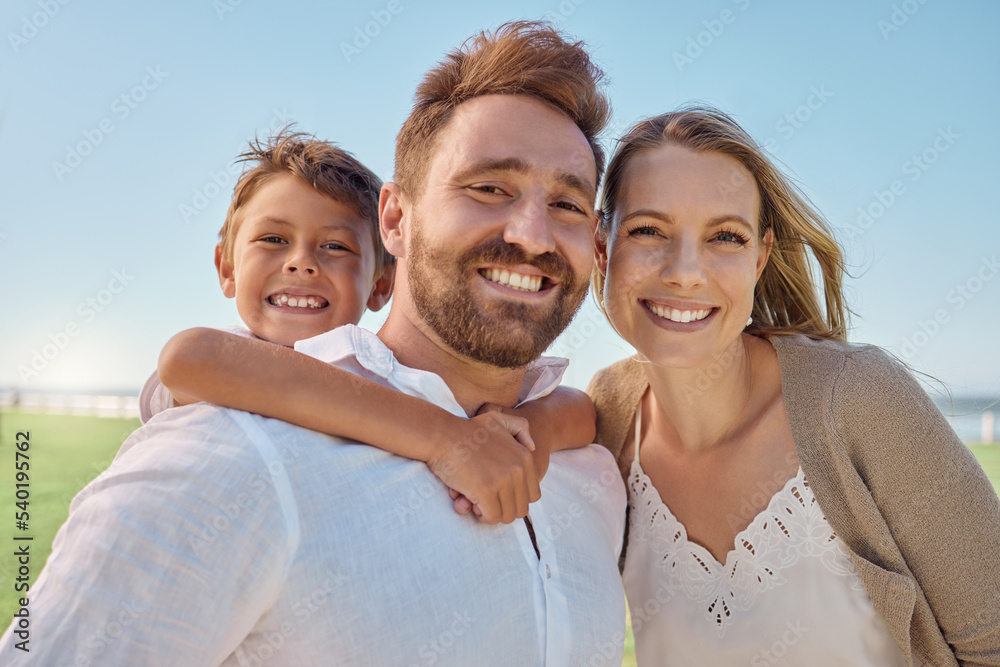 Fototapeta premium Family, children and piggyback with a man, woman and son outdoor on a field during a vacation or holiday together. Kids, travel and love with a mother and father bonding with their boy child outside