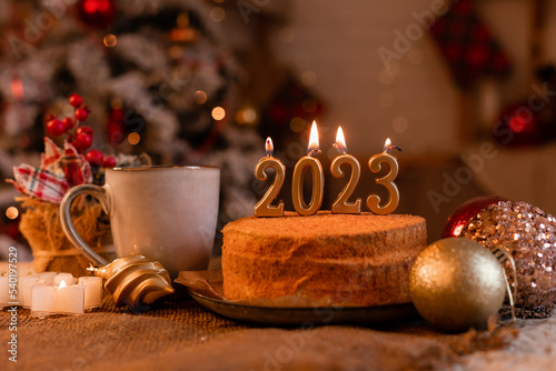 Canvas Print homemade honey cake in the kitchen with candles 2023