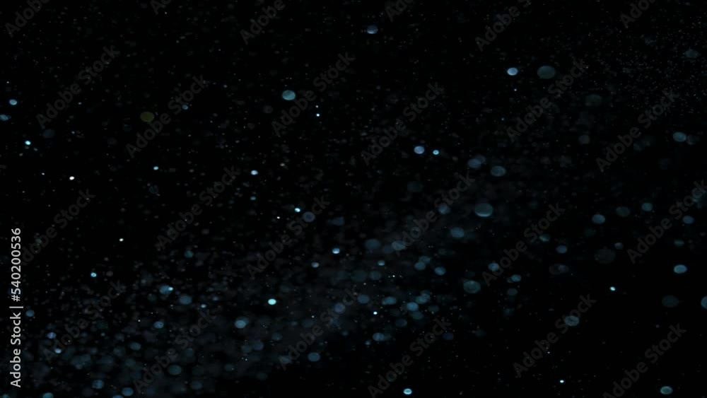 Background of shining glitter particles and sparks. Magic background for event, festival, presentation, music, show, party, award, fashion, festival, club and stage Background of shining glitter particles and sparks. Magic background for event, festival, presentation, music, show, party, award, fashion, festival, club and stage