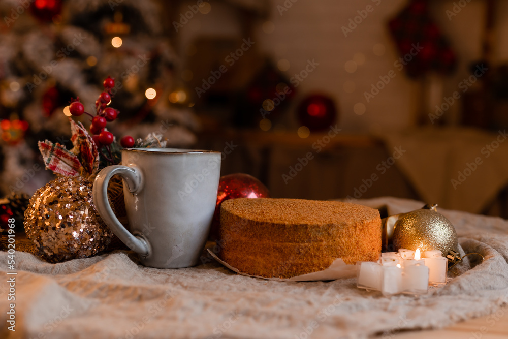coffee in a designer mug and homemade honey cake on a wooden table in a New Year atmosphere. cozy christmas, cozy winter. High quality photo