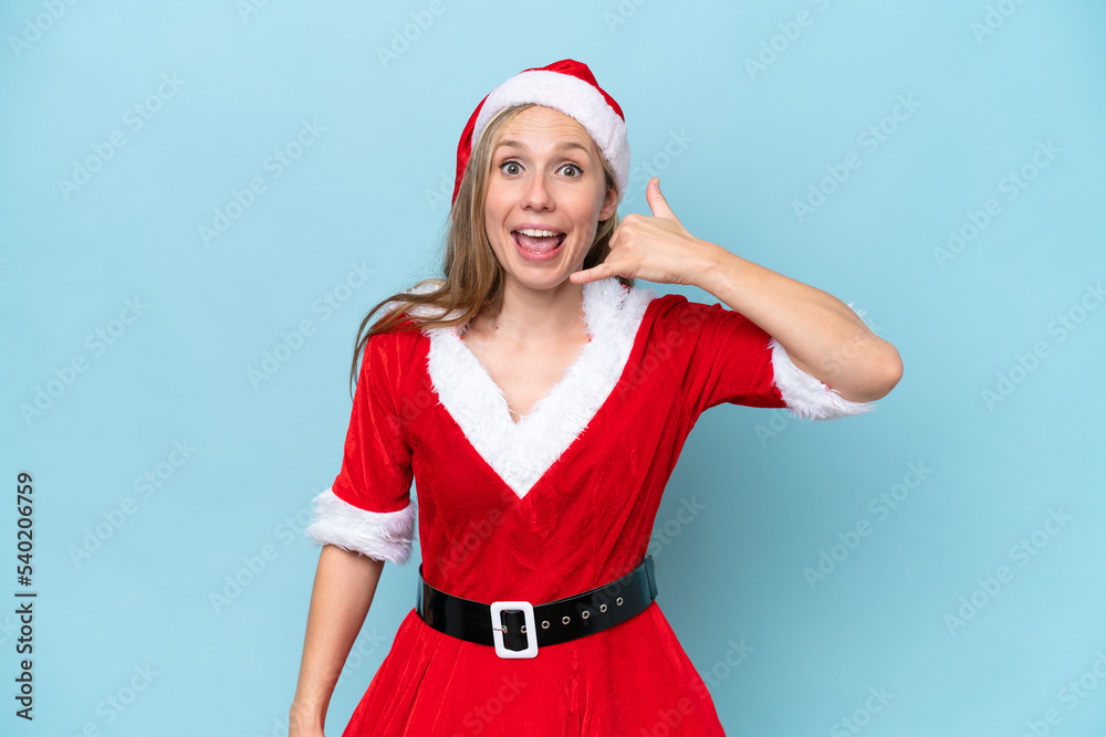 Young blonde woman dressed as mama claus isolated on blue background making phone gesture. Call me back sign Young blonde woman dressed as mama claus isolated on blue background making phone gesture. Call me back sign