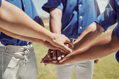Hands  team and baseball in support  trust and coordination for unity in sports on a field in the outdoors. Hand of people in teamwork piling together in motivation  collaboration or plan to win game