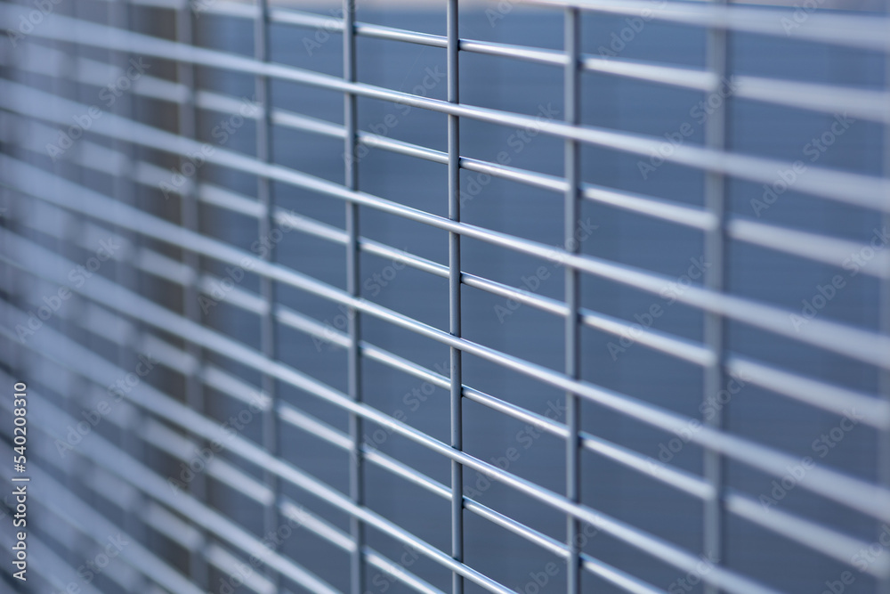Close up textured background of a metal grating grid Close up textured background of a metal grating grid