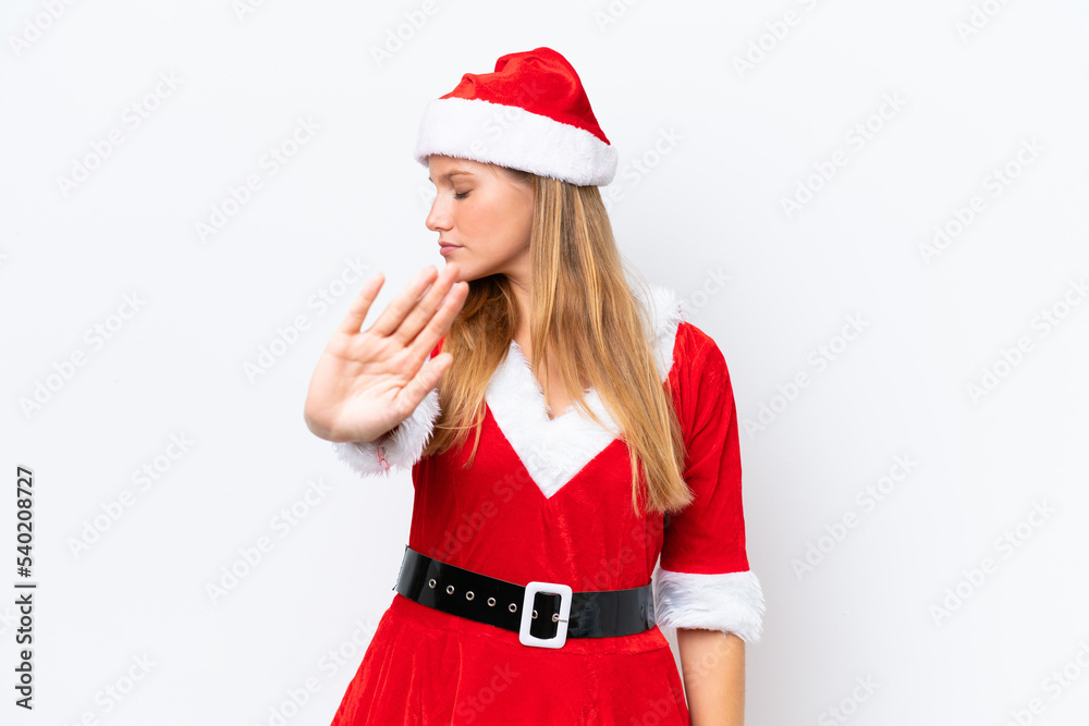 Young caucasian woman dressed as mama noel isolated on white background making stop gesture and disappointed Young caucasian woman dressed as mama noel isolated on white background making stop gesture and disappointed