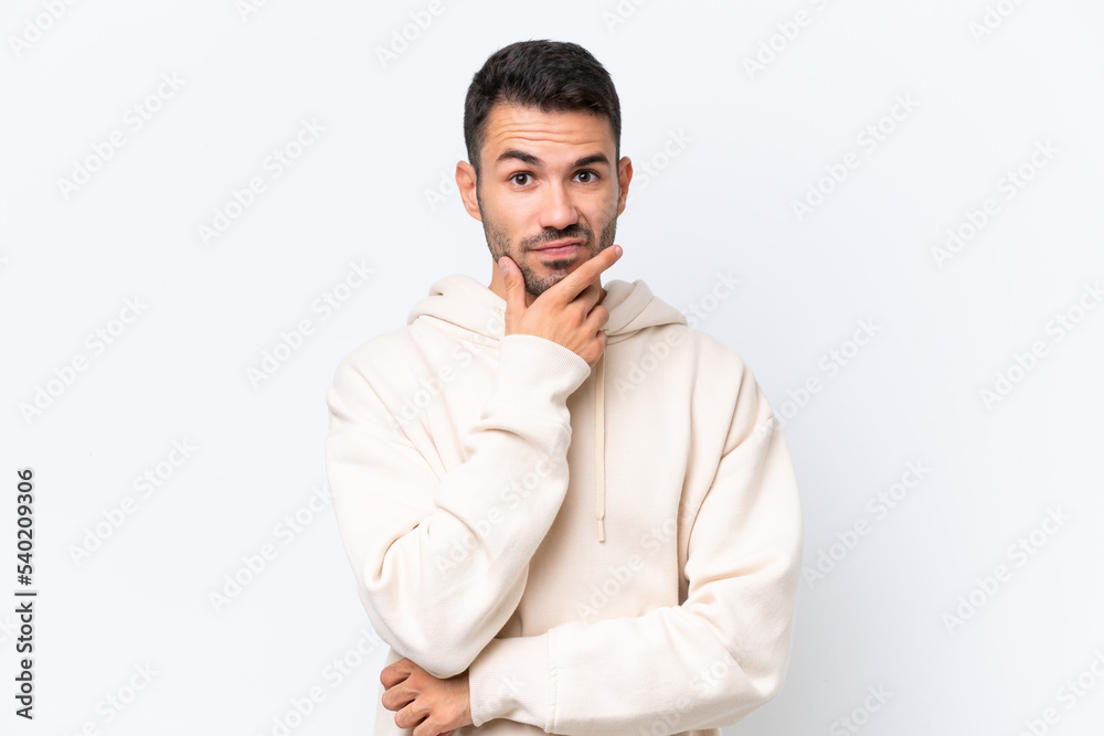 Young caucasian man isolated on white background having doubts Young caucasian man isolated on white background having doubts
