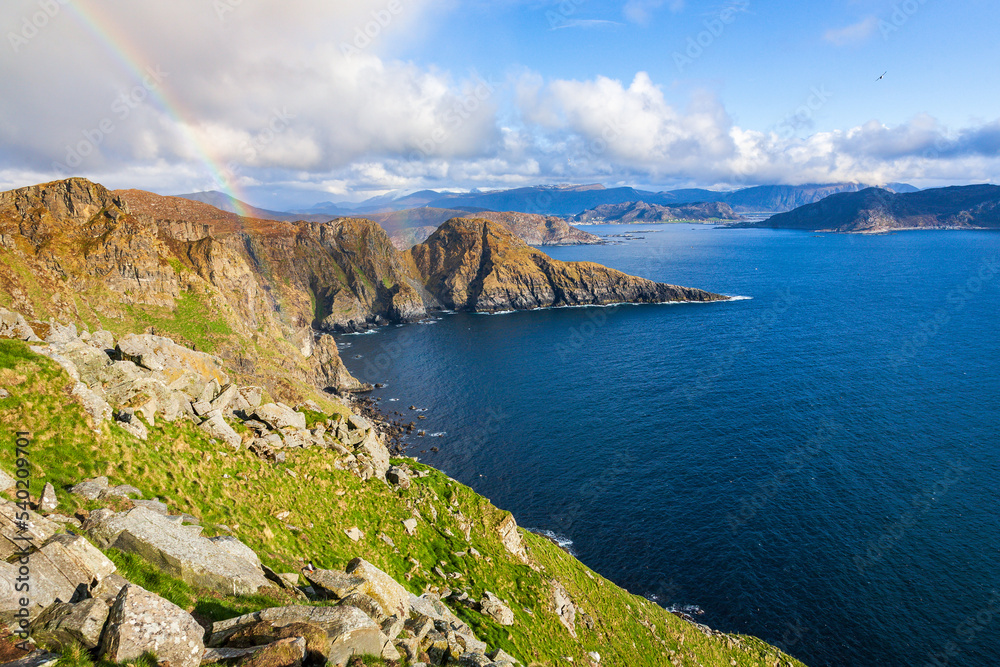 Norwegian mountainous coast with a rainbow