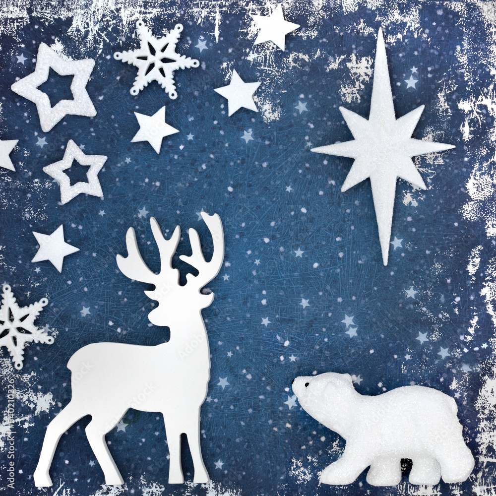 Christmas north pole fantasy background with reindeer, polar bear and star shape decorations on grunge blue background. Magical design for winter, Xmas Eve and New Year season.