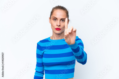 Young caucasian woman isolated on white background counting one with serious expression © luismolinero