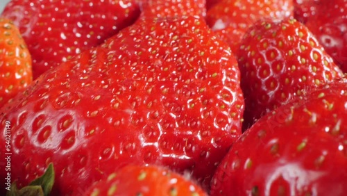 extreme close-up of a bunch of ripe strawberries, detailed. photo