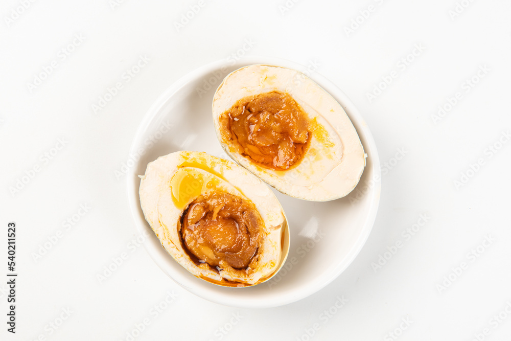 preserved Salted duck eggs with egg yolk on white background preserved Salted duck eggs with egg yolk on white background