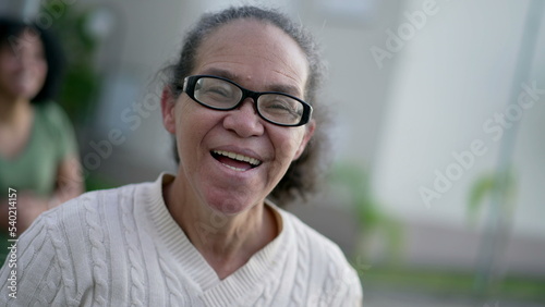 One happy senior woman laughing and smiling. South American hispanic older lady portrait face authentic real life laugh and smile 2