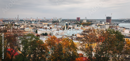 Aerial landscape view of the city during autumn. Saint Andrew's Church and ancient buildings of Andrew's Descent Podil neighborhood. Famous touristic place and travel destination. © Andrii Marushchynets