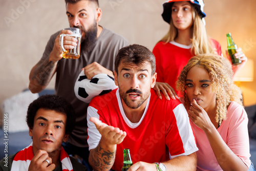 Football fans watching game on TV stressed out after their team missing the goal