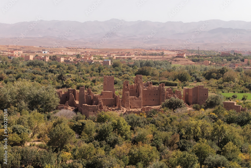 View of an old Kasbah Itran., with the high Atlas mountains in the background, Roses Valley, Morocco