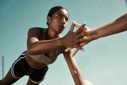 Fototapeta Naklejka Na Ścianę i Meble -  Teamwork, fitness and high five doing exercise in city, holding hands with workout partner. Health, support and black woman exercising with friend. Training, motivation and collaboration in sports