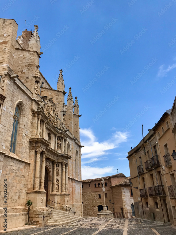 Montblanc, Spain, June 2019 - A castle with a clock at the top of a building