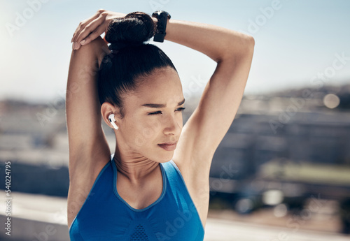 Fitness, stretching and woman with music headphones for streaming radio song, motivation podcast or audio sound. Runner girl with earphones, listening and prepare for exercise workout or training run