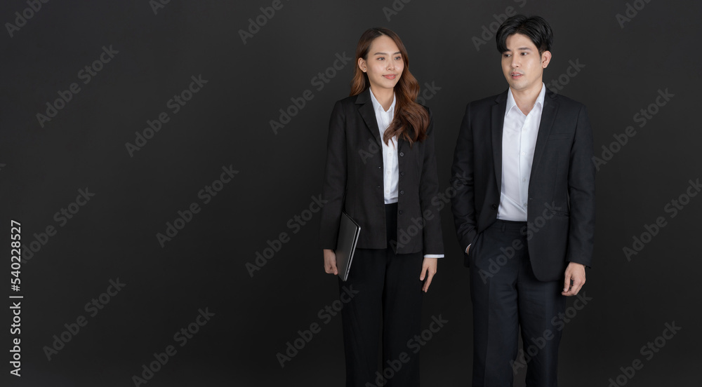 Businessman and businesswoman discussing business and smiling. Businessman and businesswoman discussing business and smiling.