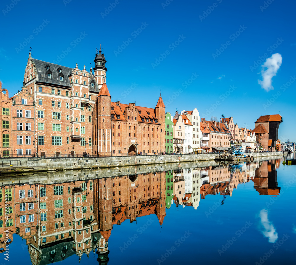 Fototapeta premium Amazing view of Gdansk old town over Motlawa river with beautiful reflection in the water. Gdansk, Poland, Europe. Artistic picture. Beauty world. Travel concept.
