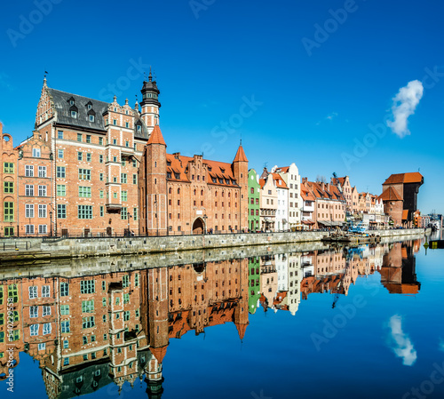 Amazing view of Gdansk old town over Motlawa river with beautiful reflection in the water. Gdansk, Poland, Europe. Artistic picture. Beauty world. Travel concept.