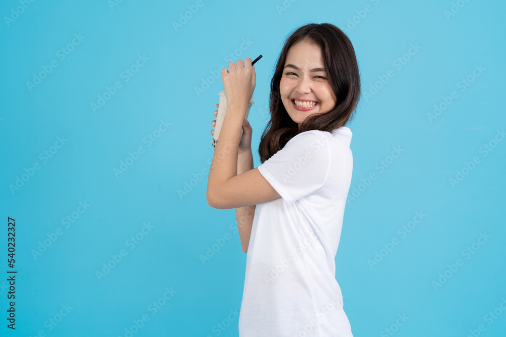 Asian girl holding a cup of pearl milk tea. Asian girl holding a cup of pearl milk tea.