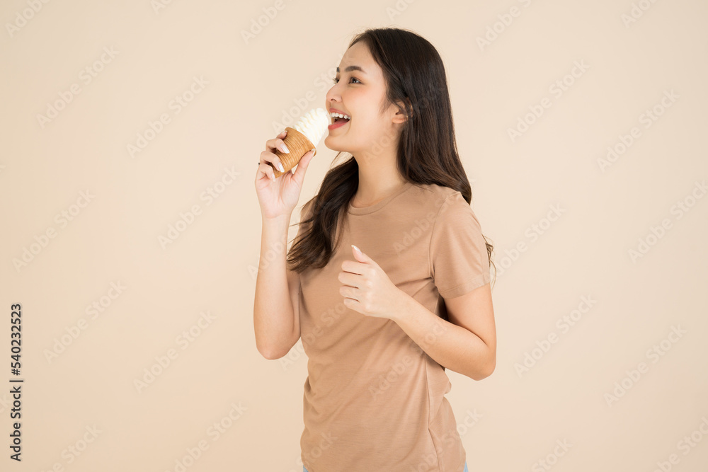 Happy young woman eating ice cream Happy young woman eating ice cream