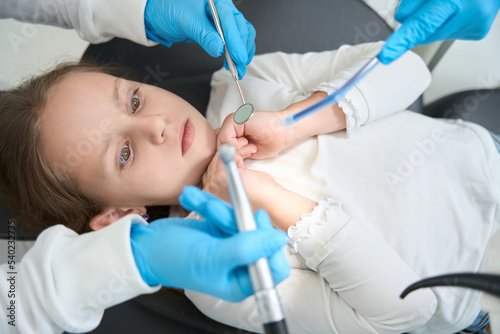Pre-teen child feeling scared of upcoming teeth treatment