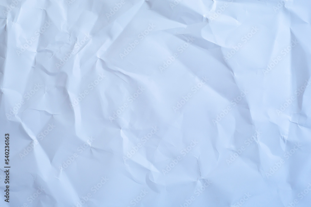 Crumpled paper in cold colors as a background. Crumpled paper in cold colors as a background.