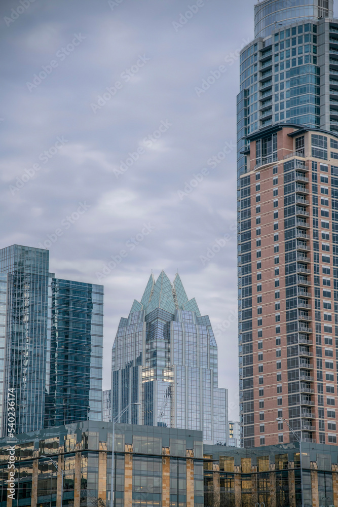 Fototapeta premium Austin, Texas- Skyscraper buildings against the cloudy sky views from Butler Metro Park
