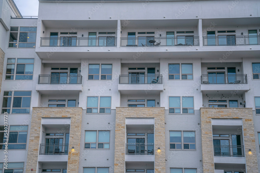 Facade of an apartment building views from Butler Metro Park- Austin, Texas Facade of an apartment building views from Butler Metro Park- Austin, Texas