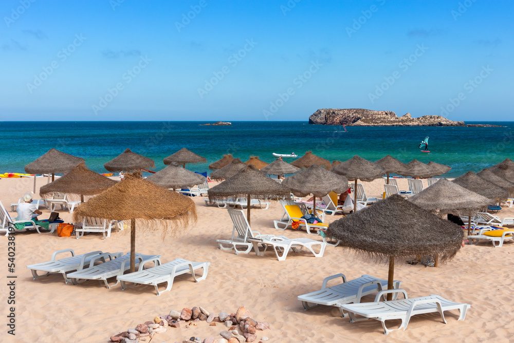 Beach with umbrellas near Sagres, Algarve, Portugal