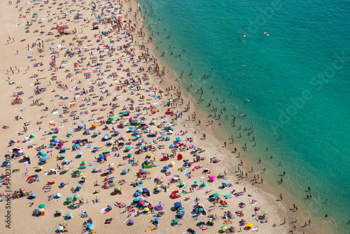 Aerial view of a crowded beach from above, praia de Nazaré, Portugal, Europe
