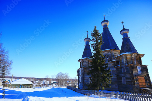 wooden church in the Russian north landscape in winter, architecture historical religion Christianity photo