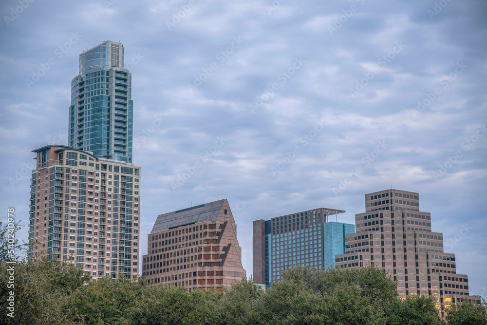 Cityscape above the trees views from Butler Metro Park- Austin, Texas Cityscape above the trees views from Butler Metro Park- Austin, Texas