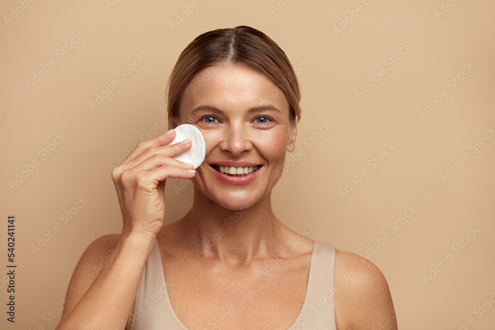 Woman Cleaning Face With White Pad. Beautiful Girl Removing Makeup White Cosmetic Cotton Pad. Happy Female Taking Off Makeup From Facial Skin With Cosmetic Pad. Hight Quality Image Woman Cleaning Face With White Pad. Beautiful Girl Removing Makeup White Cosmetic Cotton Pad. Happy Female Taking Off Makeup From Facial Skin With Cosmetic Pad. Hight Quality Image