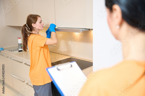 Females from cleaning company working in apartment