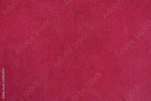 Textile and texture concept - closeup of crumpled pink fabric background, 