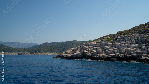 Mountain of rocks in the foreground over the sea © ANGEL LARA FOTO