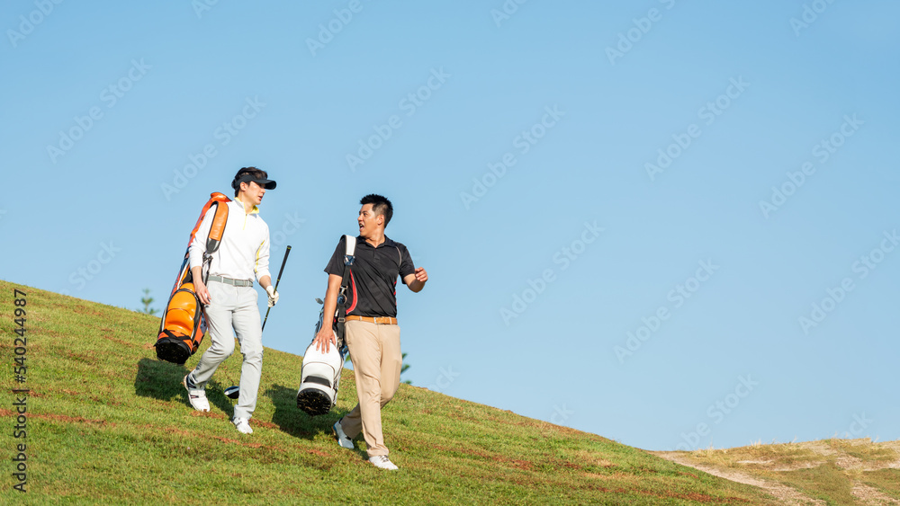 Golfer sport course golf ball fairway.  Group People lifestyle man and friend playing game golf tee off on the green grass.  Asia men player game shot in summer.Â  Healthy and Sport outdoor