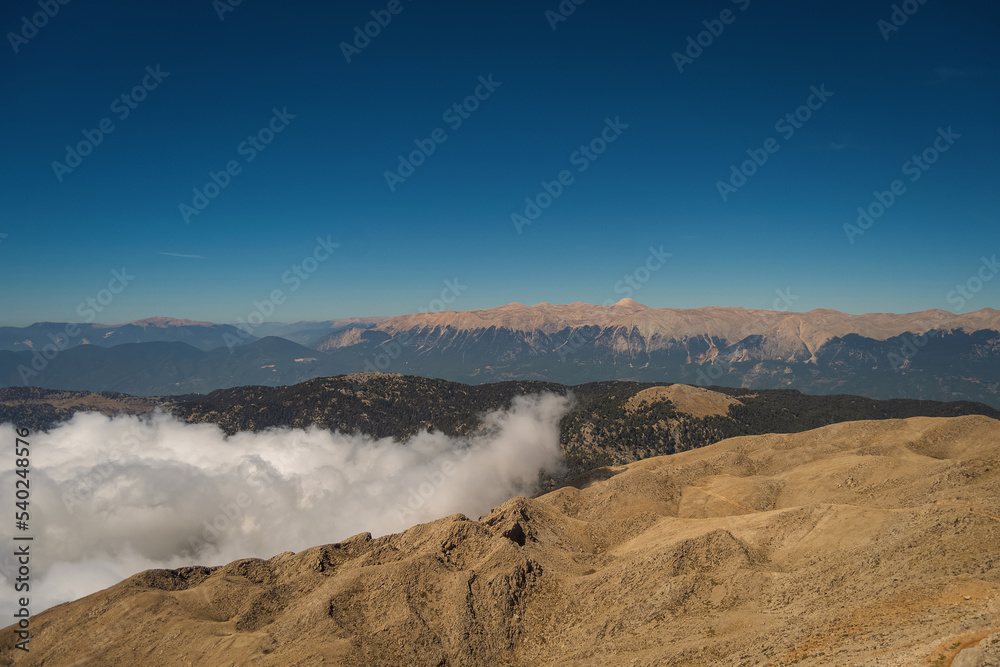 Clouds and blue sky over the mountains Clouds and blue sky over the mountains