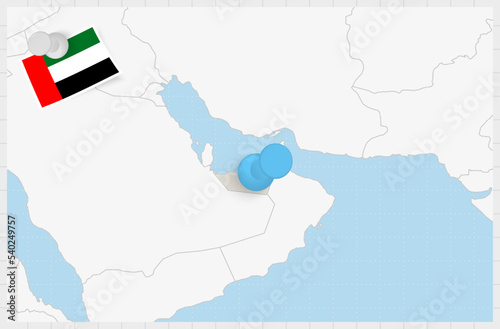 Map of United Arab Emirates with a pinned blue pin. Pinned flag of United Arab Emirates.