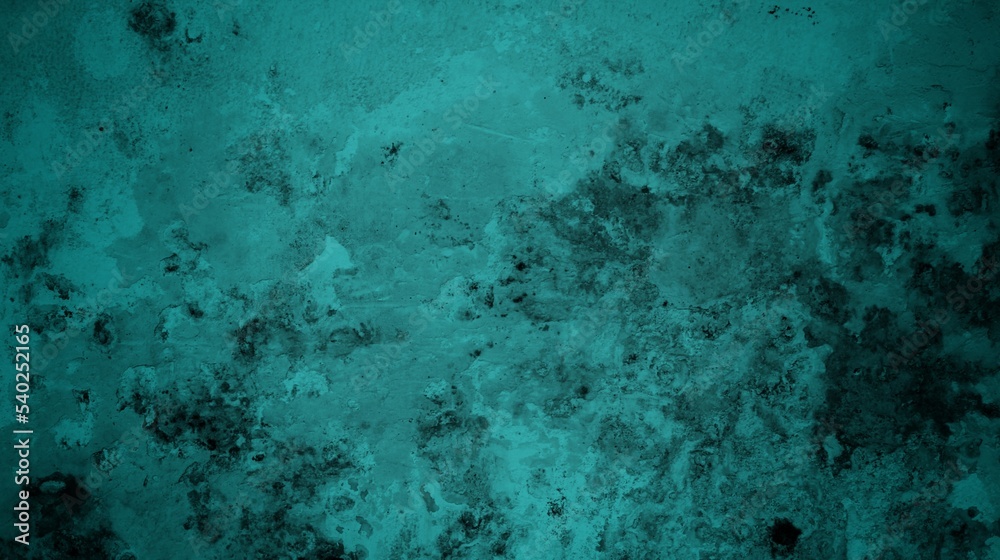 Obraz premium A textured background featuring a deep teal color with a distressed, grunge appearance. The surface shows variations in tone and subtle patterns, creating an abstract and moody aesthetic.