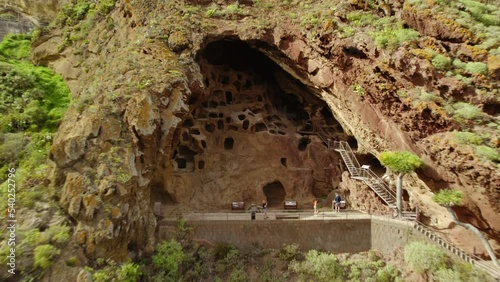 Aerial footage of Cenobio de Valeron, archeological site, aboriginal caves in Grand Canary, Canary islands. Aboriginal barn on top of an escarpment El Cenobio de Valerón.
 photo