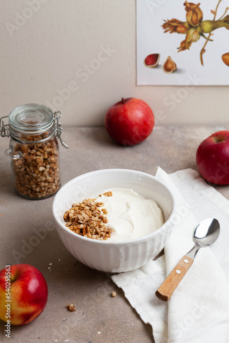 Fototapeta Naklejka Na Ścianę i Meble -  Healthy breakfast of apples, granola and yogurt