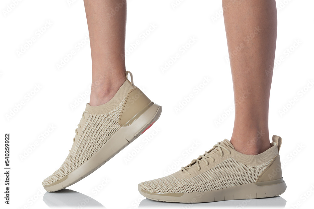 Men wearing sneakers shoes stepping pose of side view isolated on white background Men wearing sneakers shoes stepping pose of side view isolated on white background