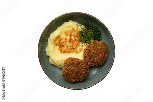 Cutlets and mashed potatoes in a plate. Isolated on white. View from above. transparent