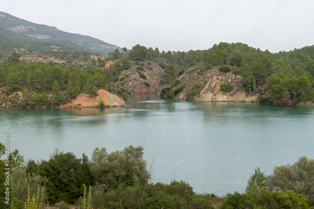 Beautiful landscape of the cortes del pallas reservoir with the mountain cuts and its grove everywhere in the Valencian community, Spain